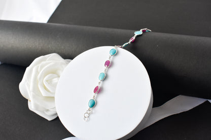 Ruby and turquoise cabochon bracelet with bezel-set stones in 925 silver