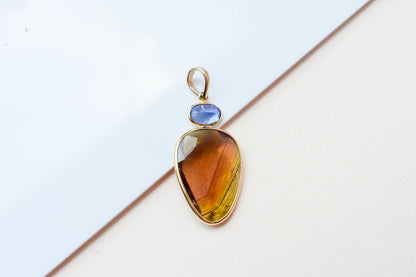 18K gold pendant with tourmaline slice and tanzanite accent