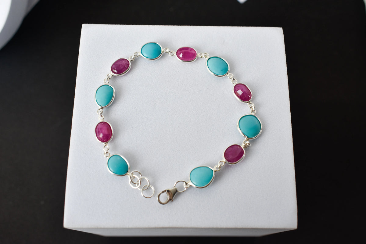 Ruby and turquoise cabochon bracelet with bezel-set stones in 925 silver