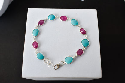 Ruby and turquoise cabochon bracelet with bezel-set stones in 925 silver