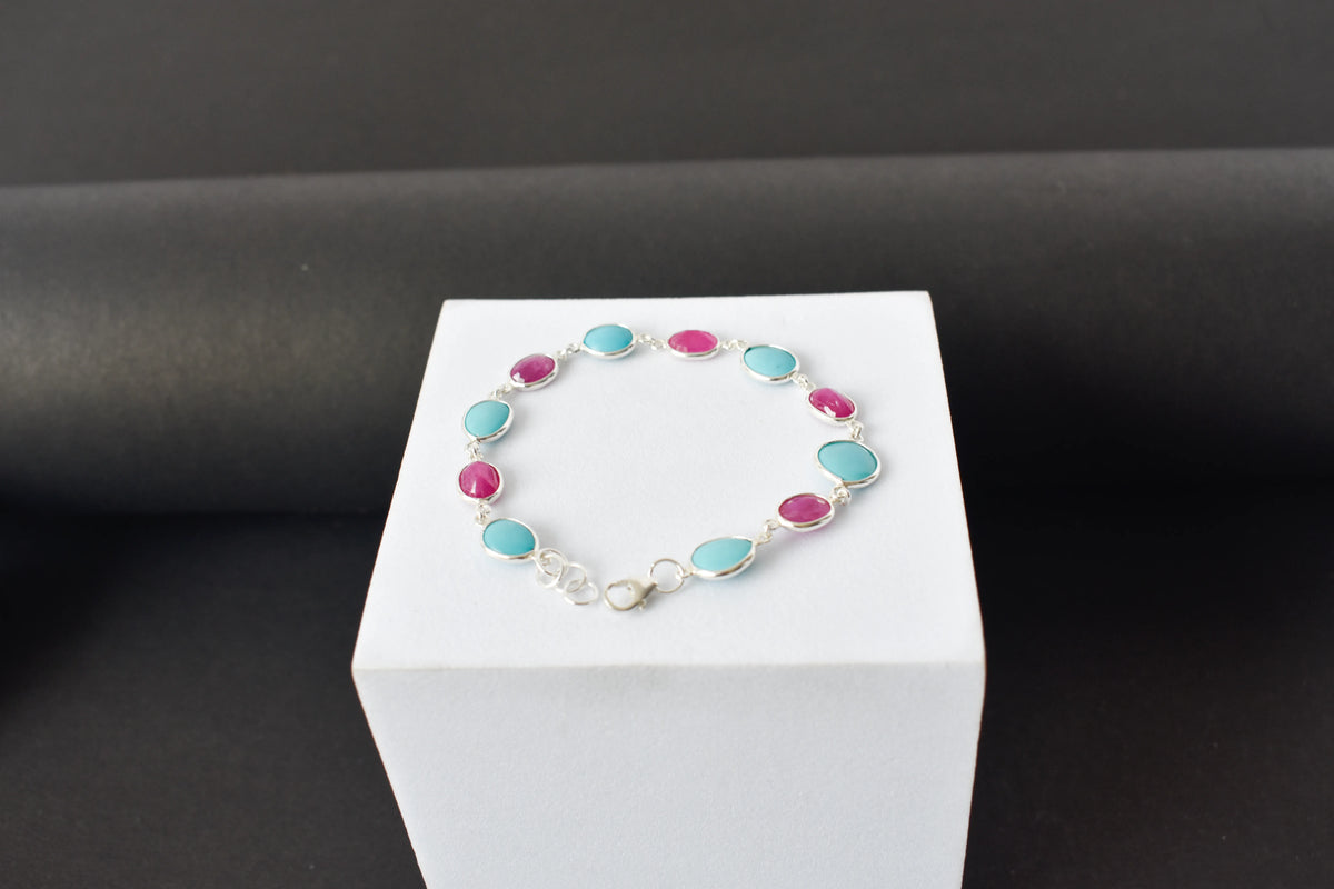 Ruby and turquoise cabochon bracelet with bezel-set stones in 925 silver