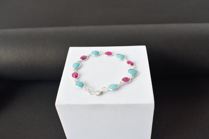 Ruby and turquoise cabochon bracelet with bezel-set stones in 925 silver