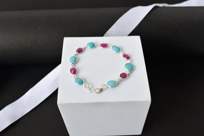 Ruby and turquoise cabochon bracelet with bezel-set stones in 925 silver