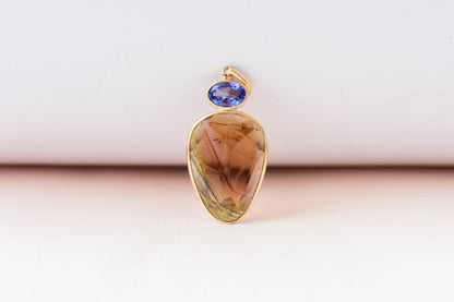 18K gold pendant with tourmaline slice and tanzanite accent