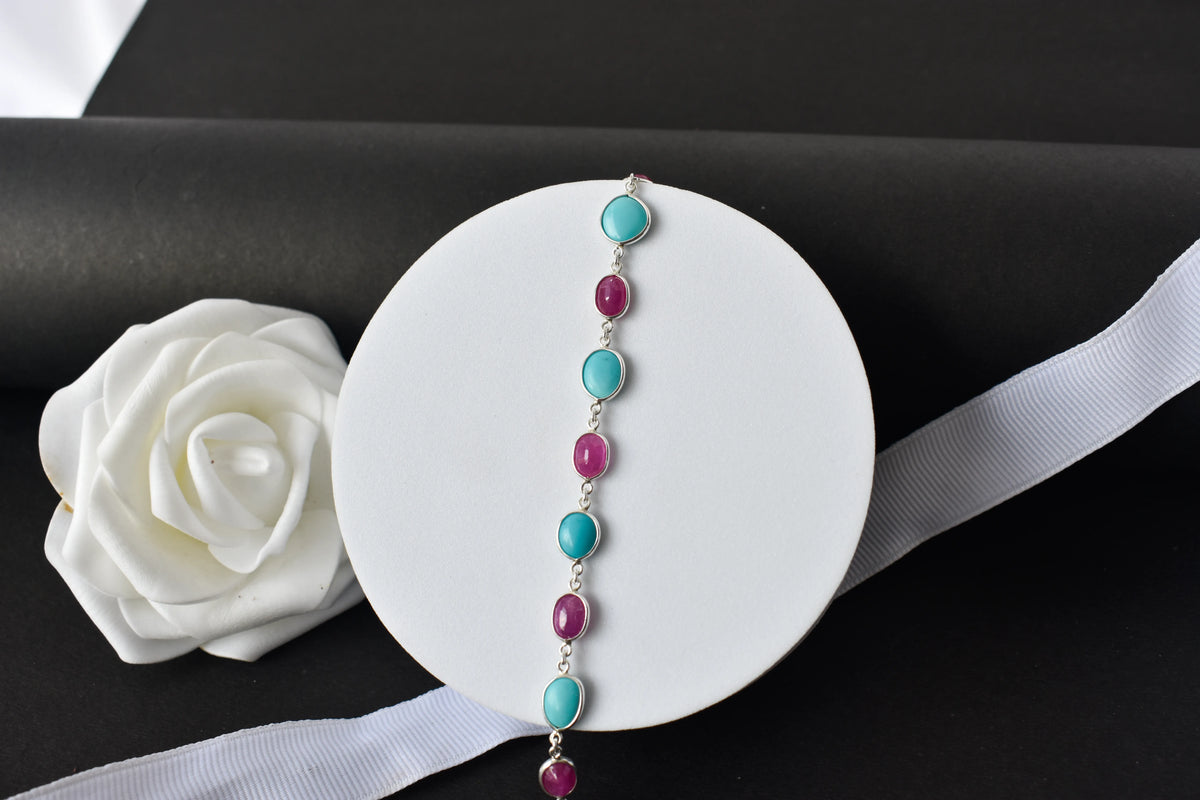 Ruby and turquoise cabochon bracelet with bezel-set stones in 925 silver