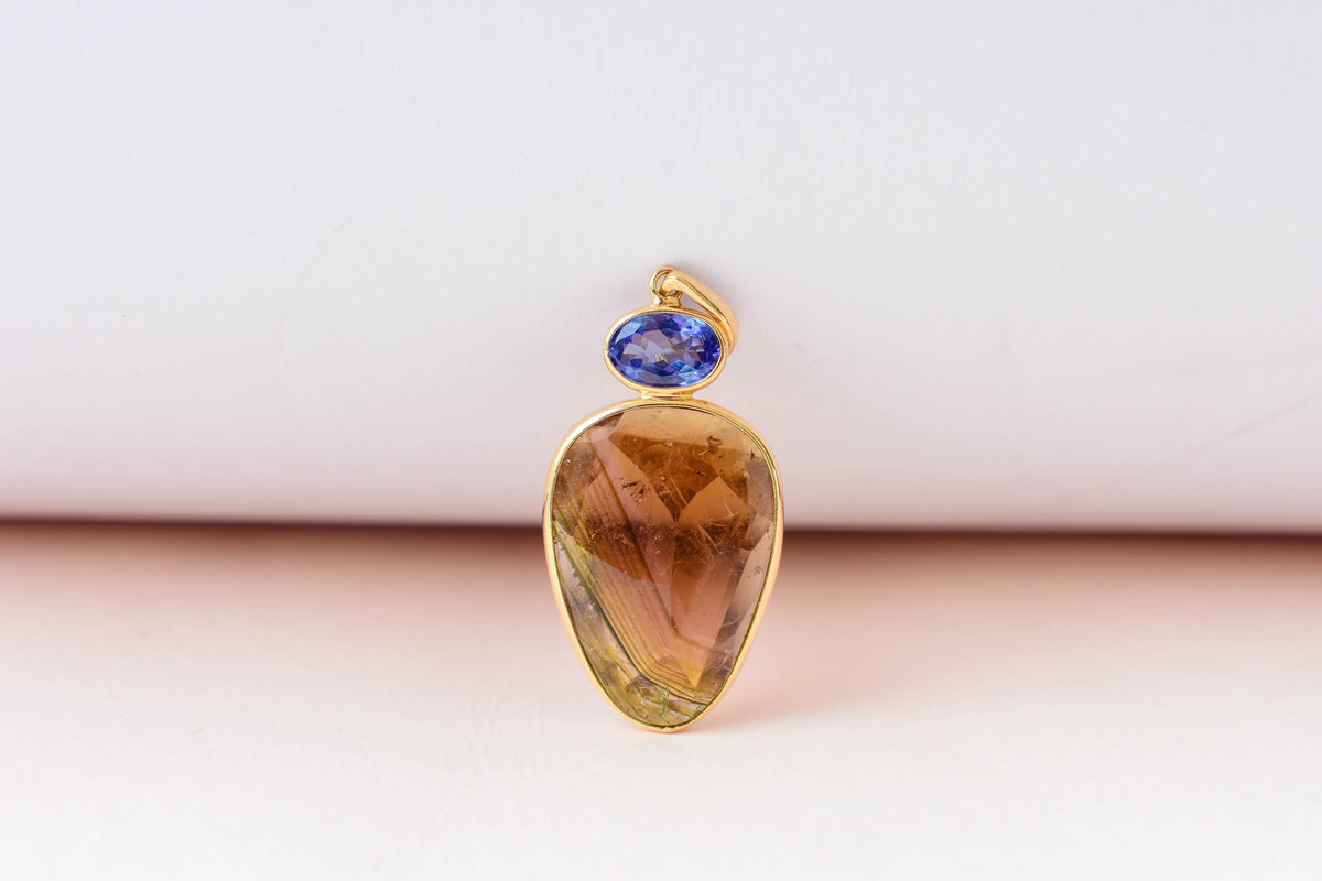 18K gold pendant with tourmaline slice and tanzanite accent