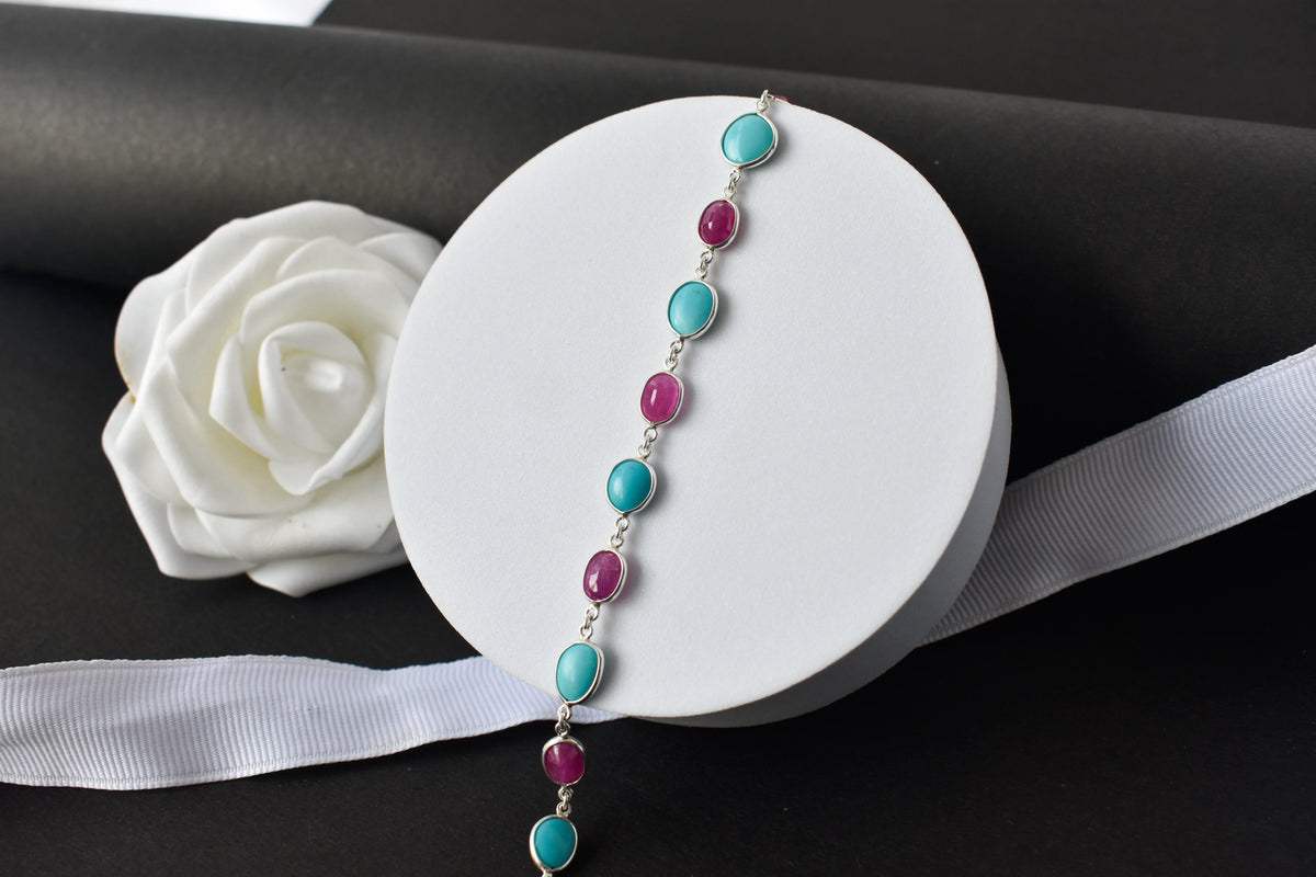 Ruby and turquoise cabochon bracelet with bezel-set stones in 925 silver