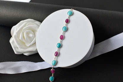 Ruby and turquoise cabochon bracelet with bezel-set stones in 925 silver