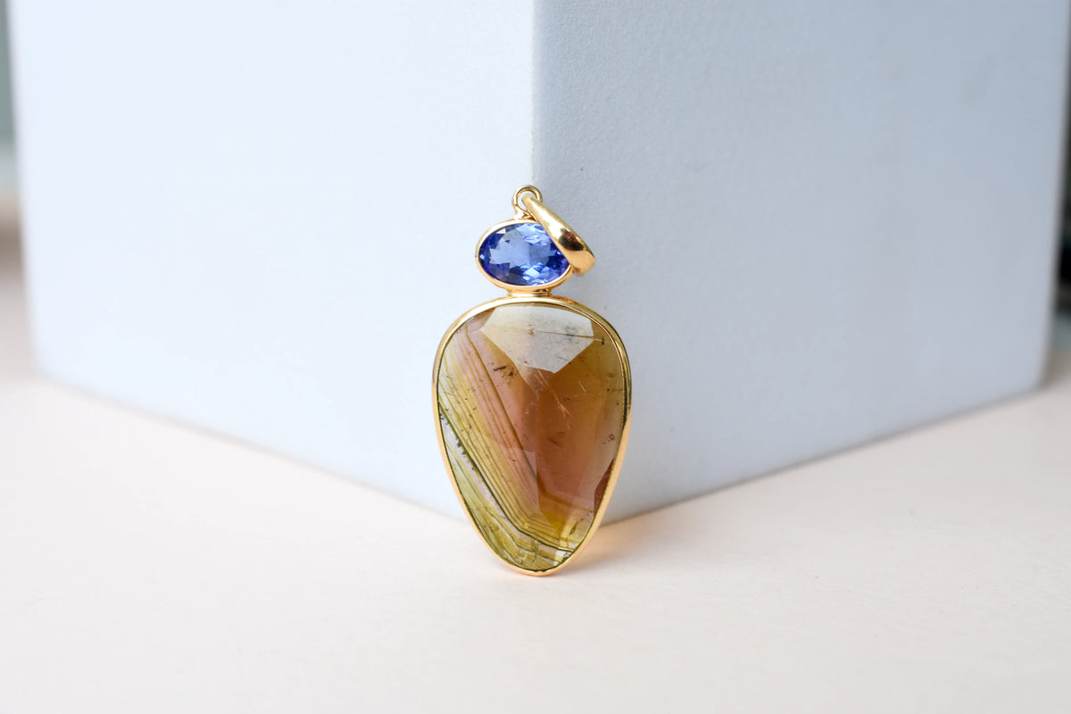 18K gold pendant with tourmaline slice and tanzanite accent