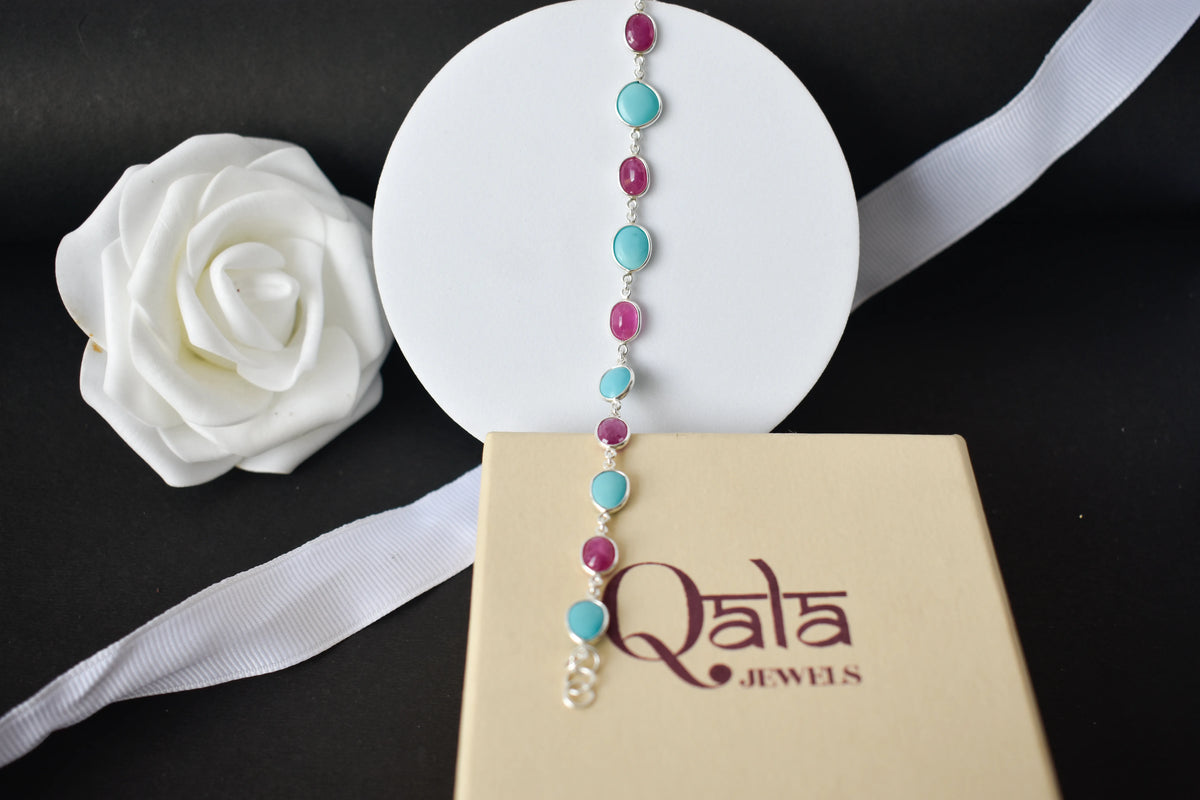 Ruby and turquoise cabochon bracelet with bezel-set stones in 925 silver