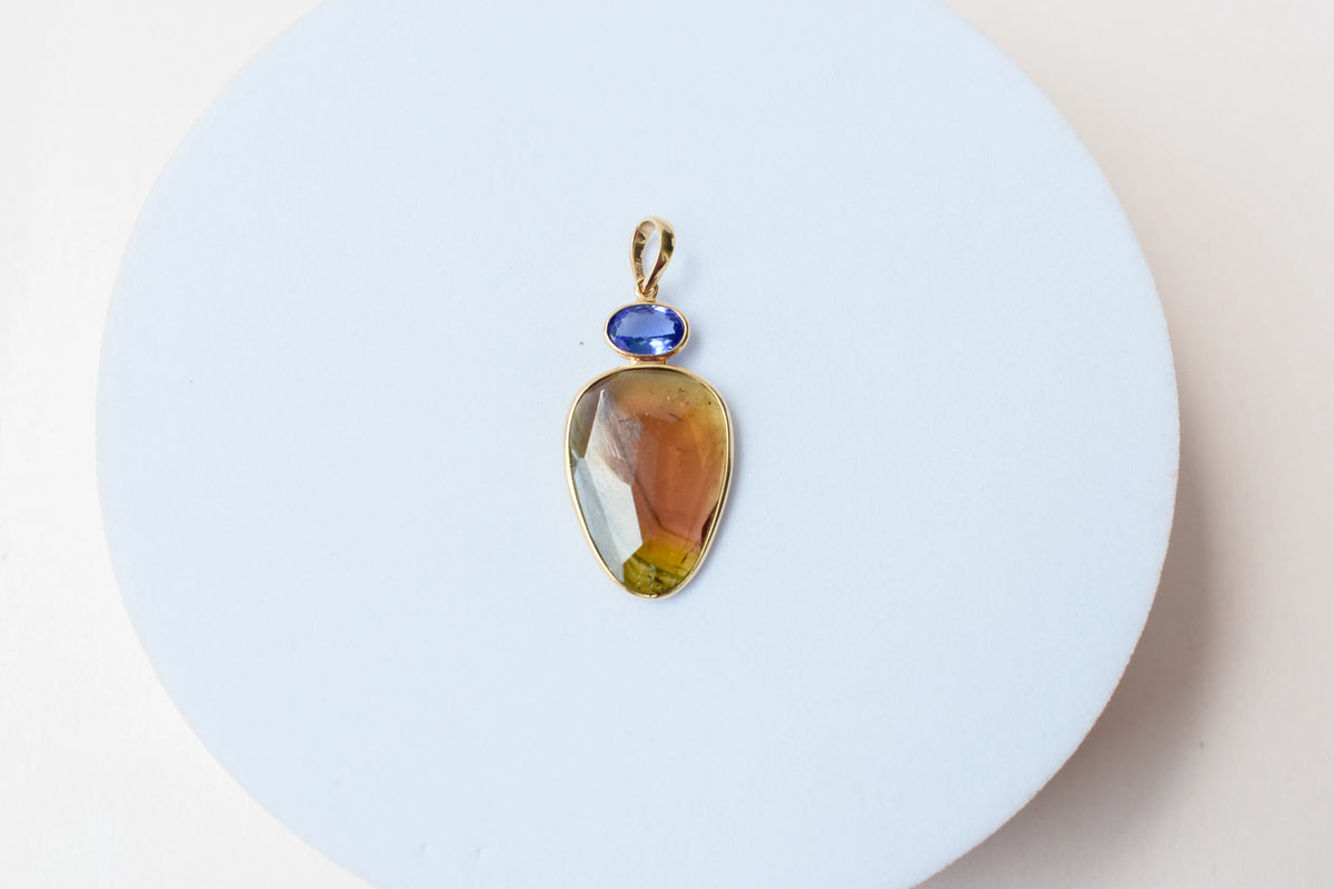 18K gold pendant with tourmaline slice and tanzanite accent