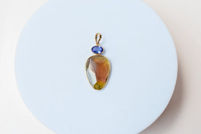 18K gold pendant with tourmaline slice and tanzanite accent