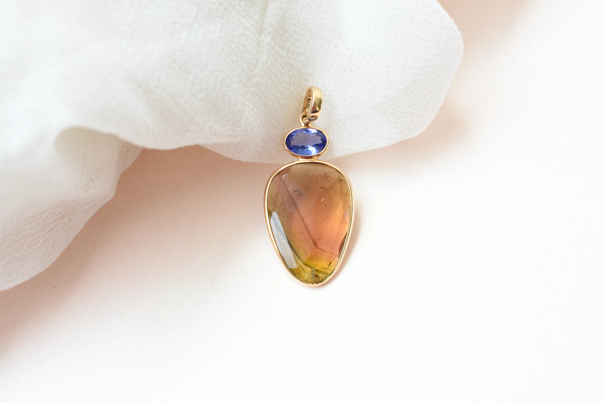 18K gold pendant with tourmaline slice and tanzanite accent