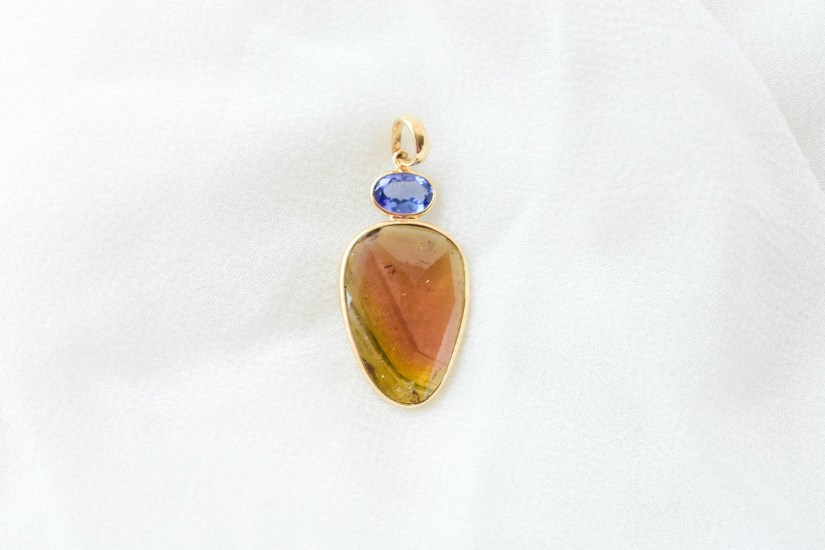 18K gold pendant with tourmaline slice and tanzanite accent