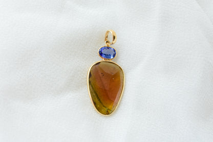 18K gold pendant with tourmaline slice and tanzanite accent