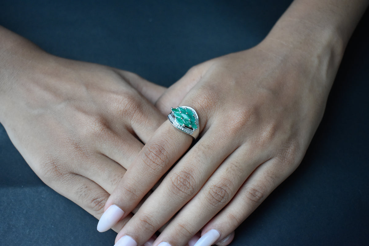 Emerald cluster ring in 925 silver with marquise-cut emeralds and cubic zirconia band