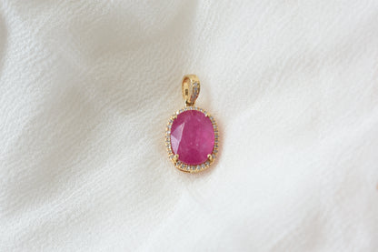 18K gold pendant with ruby and diamond halo