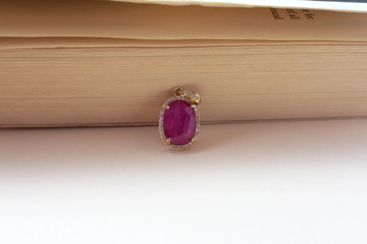 18K gold pendant with ruby and diamond halo