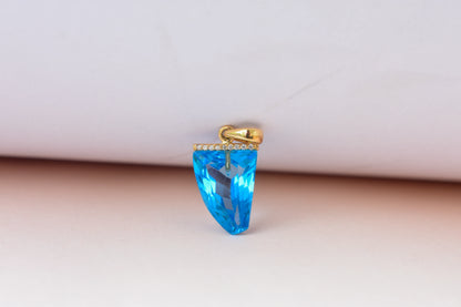 18K gold pendant with faceted blue topaz and diamond bail