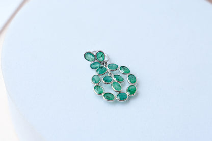 14K gold pendant with a wreath of bezel-set emeralds