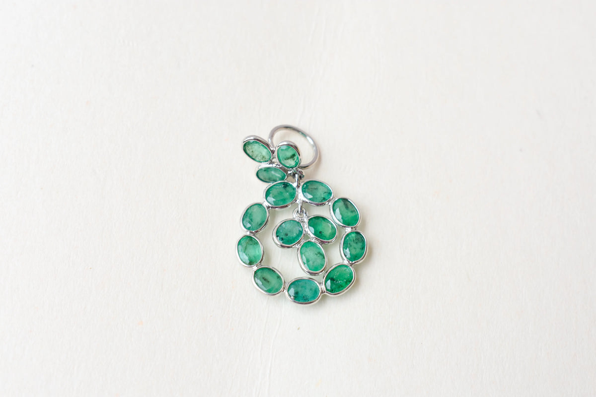 14K gold pendant with a wreath of bezel-set emeralds