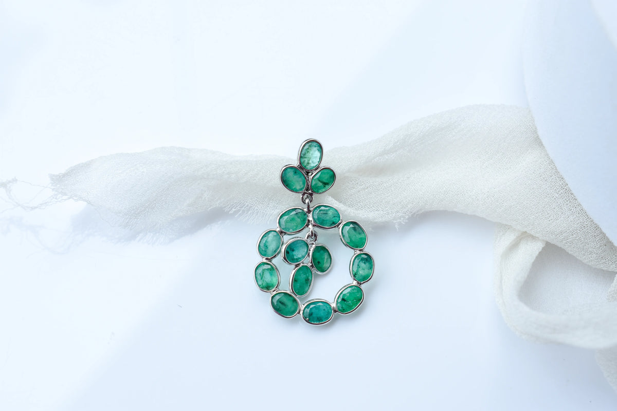 14K gold pendant with a wreath of bezel-set emeralds
