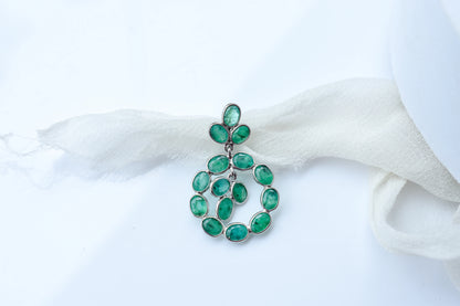14K gold pendant with a wreath of bezel-set emeralds