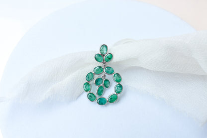 14K gold pendant with a wreath of bezel-set emeralds