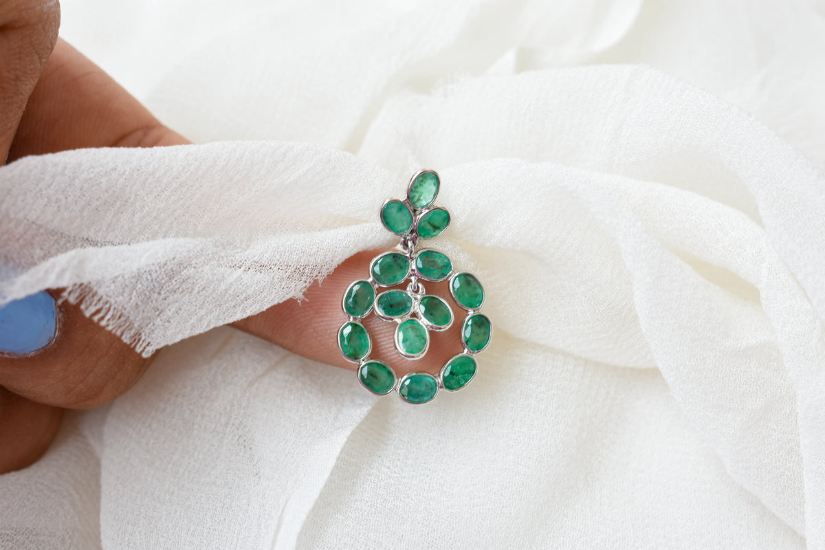 14K gold pendant with a wreath of bezel-set emeralds