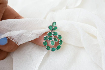 14K gold pendant with a wreath of bezel-set emeralds