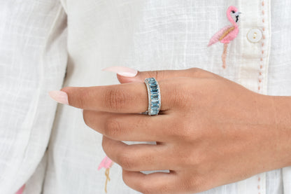 Sky blue topaz wide emerald-cut eternity ring in 925 silver