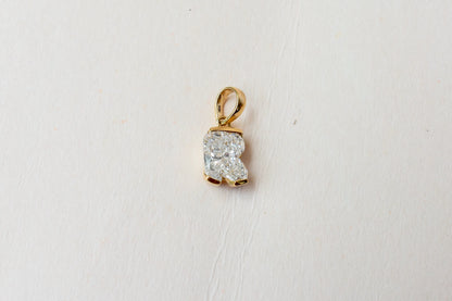 18K gold pendant with lab-grown diamond cut into the letter R