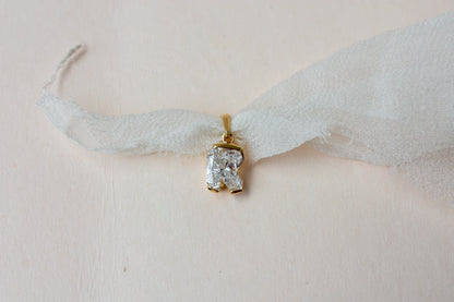 18K gold pendant with lab-grown diamond cut into the letter R
