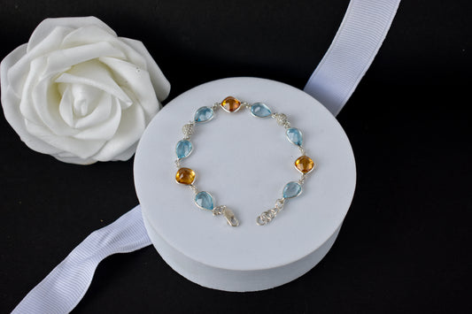 Citrine and blue topaz dangle bracelet with cubic zirconia accents in 925 silver