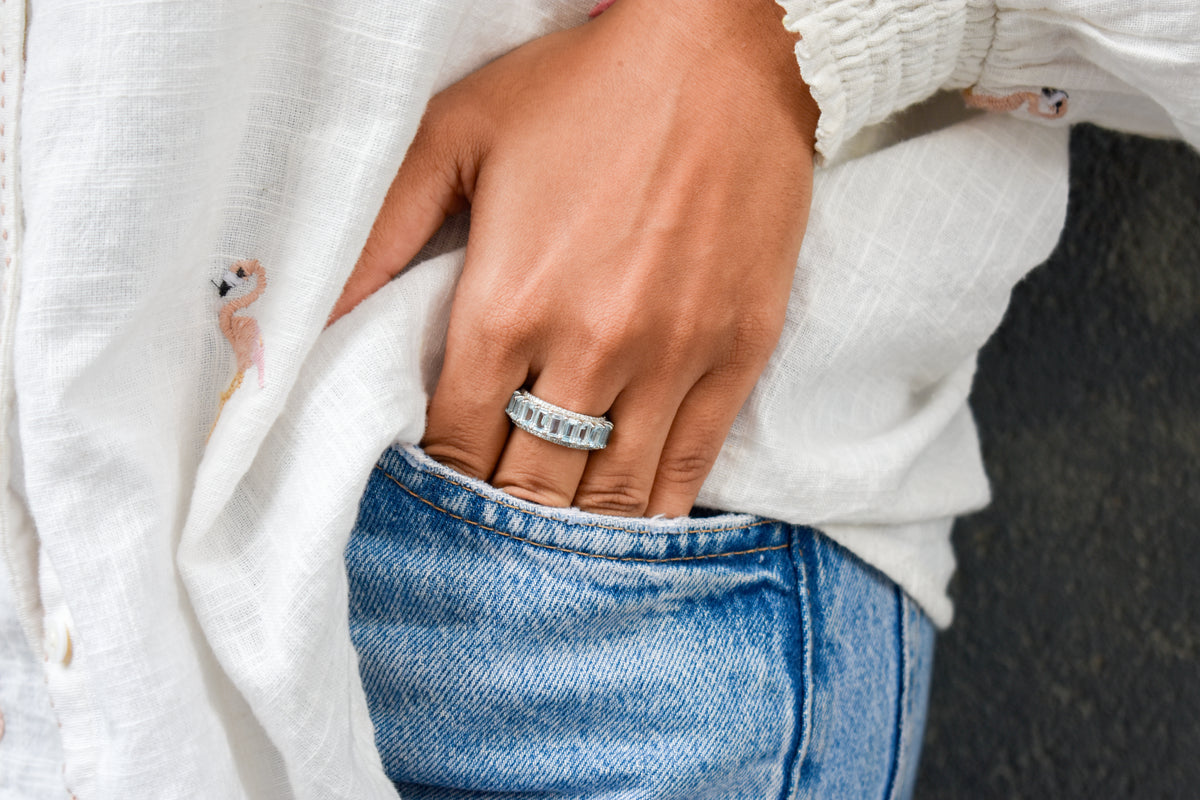 Sky blue topaz emerald-cut eternity ring in 925 silver
