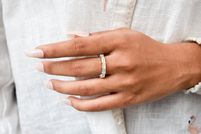 Opalescent white baguette eternity ring in 925 silver