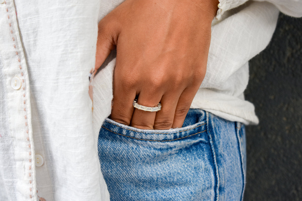 Opalescent white baguette eternity ring in 925 silver