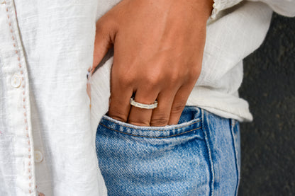 Opalescent white baguette eternity ring in 925 silver