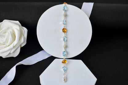 Citrine and blue topaz dangle bracelet with cubic zirconia accents in 925 silver