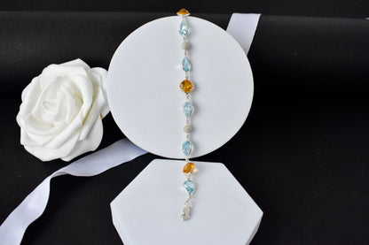 Citrine and blue topaz dangle bracelet with cubic zirconia accents in 925 silver