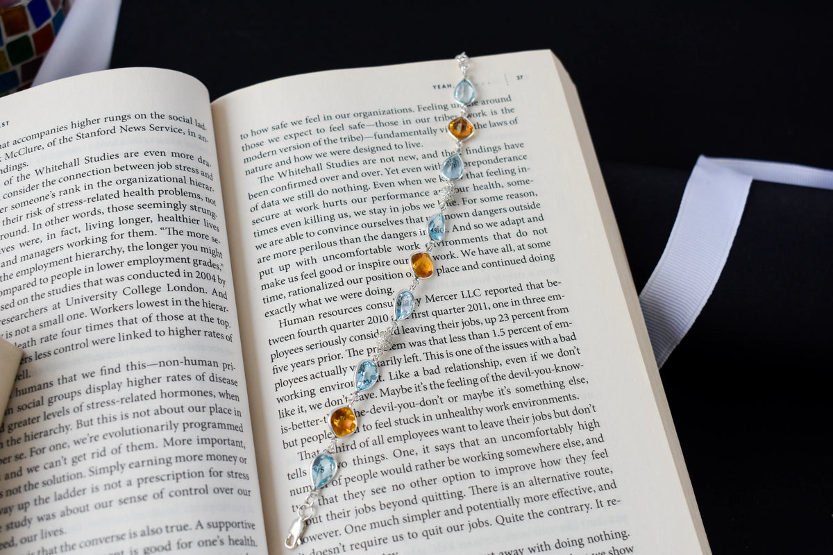 Citrine and blue topaz dangle bracelet with cubic zirconia accents in 925 silver