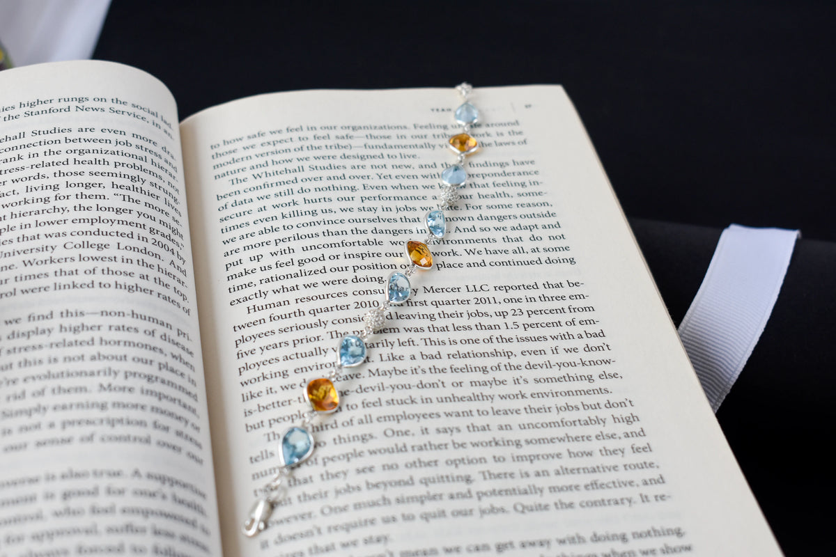 Citrine and blue topaz dangle bracelet with cubic zirconia accents in 925 silver