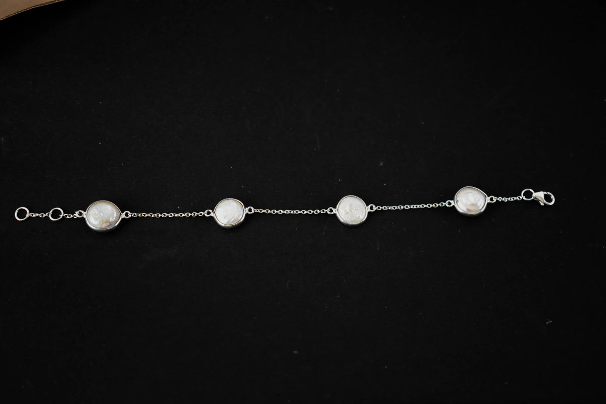 Coin pearl station bracelet with bezel-set pearls on a 925 silver chain