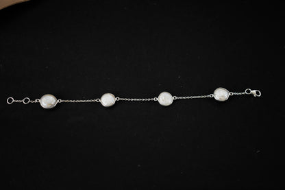 Coin pearl station bracelet with bezel-set pearls on a 925 silver chain