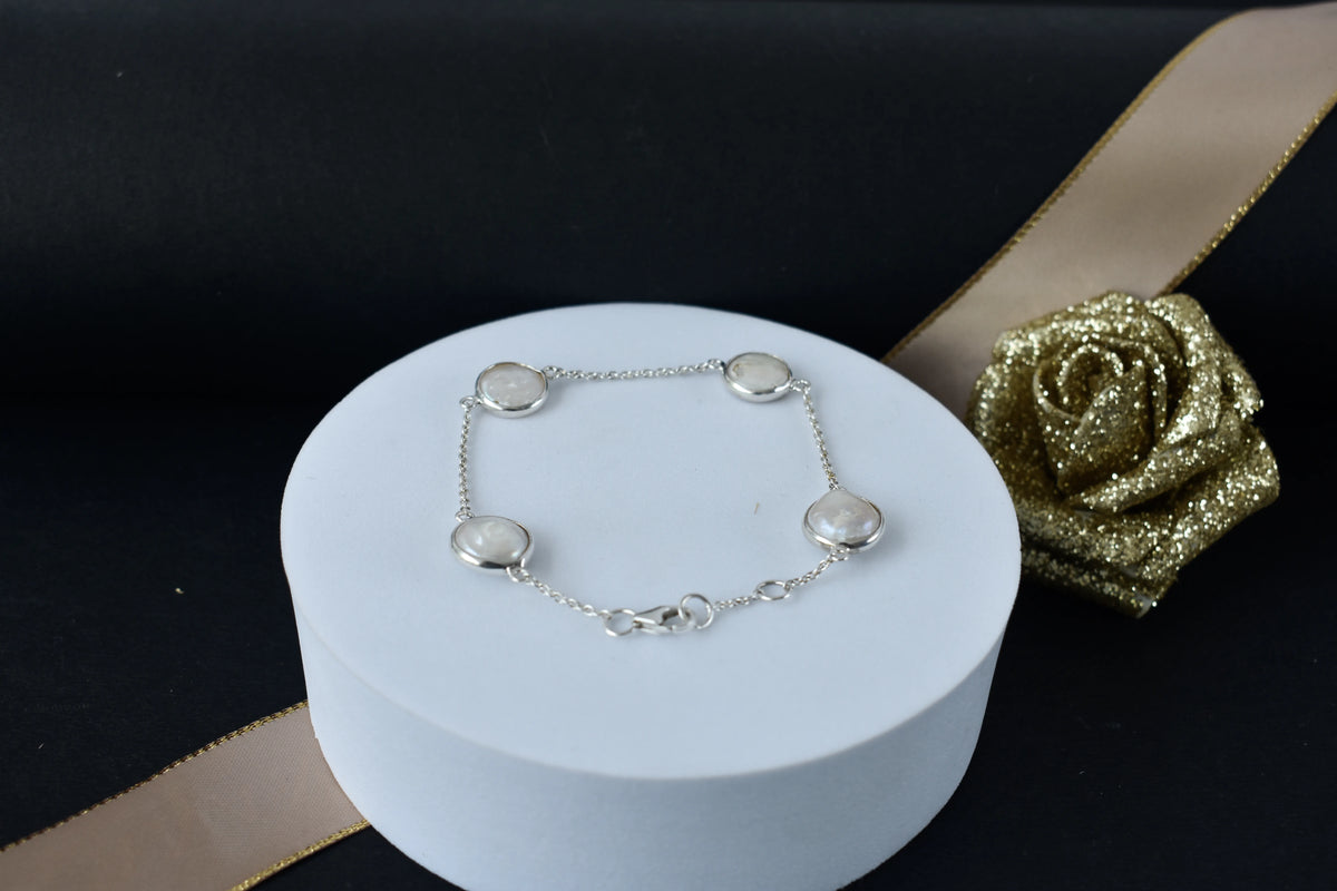 Coin pearl station bracelet with bezel-set pearls on a 925 silver chain