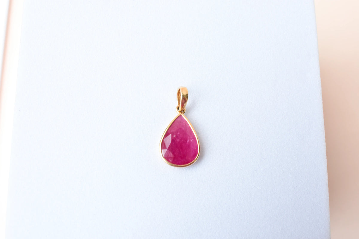 18K gold pendant with bezel-set rose-cut pear ruby