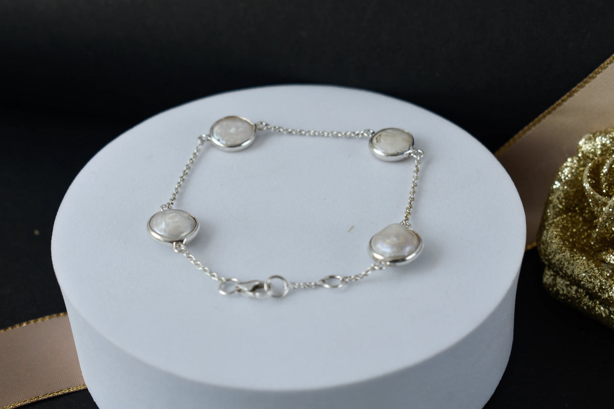 Coin pearl station bracelet with bezel-set pearls on a 925 silver chain