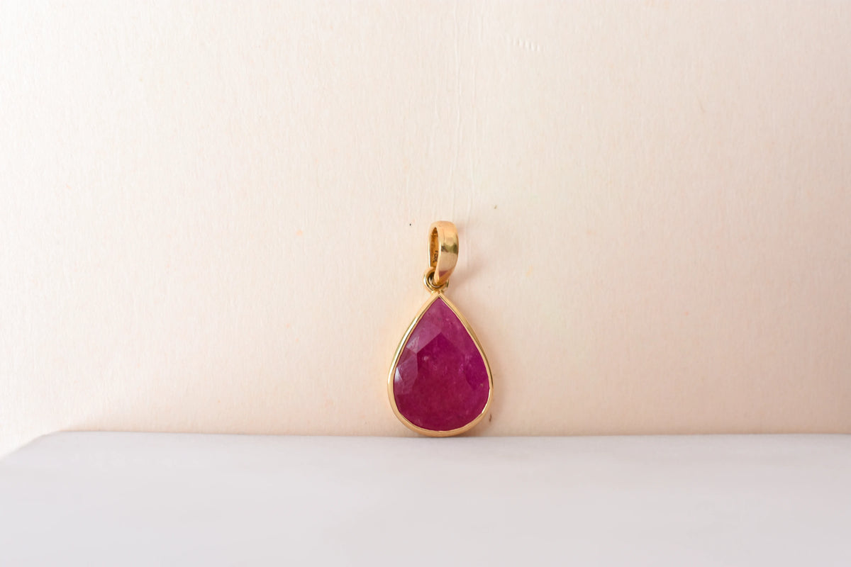 18K gold pendant with bezel-set rose-cut pear ruby