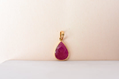 18K gold pendant with bezel-set rose-cut pear ruby