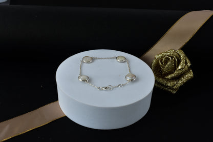 Coin pearl station bracelet with bezel-set pearls on a 925 silver chain